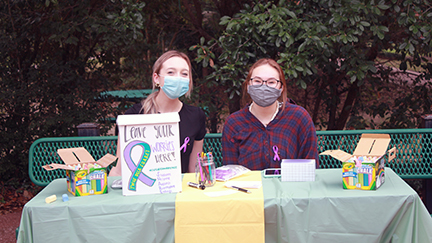 Grace Murphy (left) and Leilani Beard (right) in the TWHS courtyard manning the chalk station.