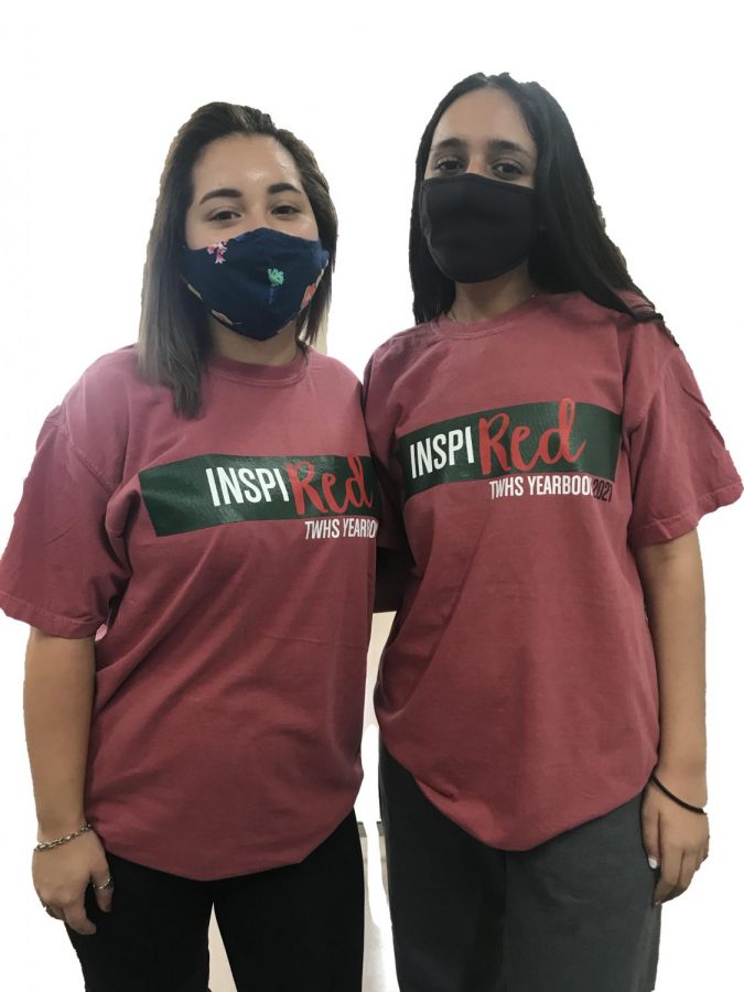 Staffers Morgan Arnold (left) and Sarah Aghajan wear their yearbook t-shirts while working on this years book.