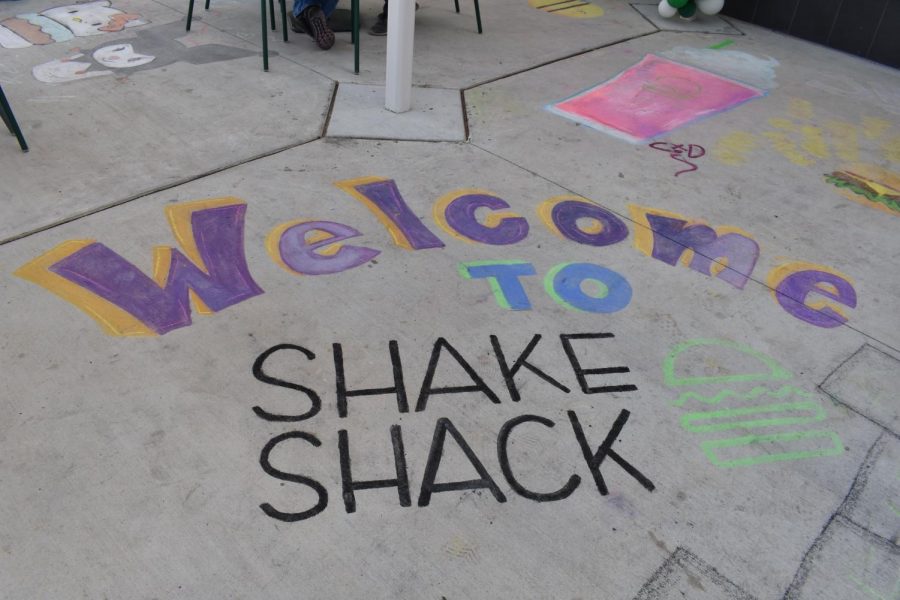 Chalking the walk outside on opening day with art and messages was fun for Art Club.