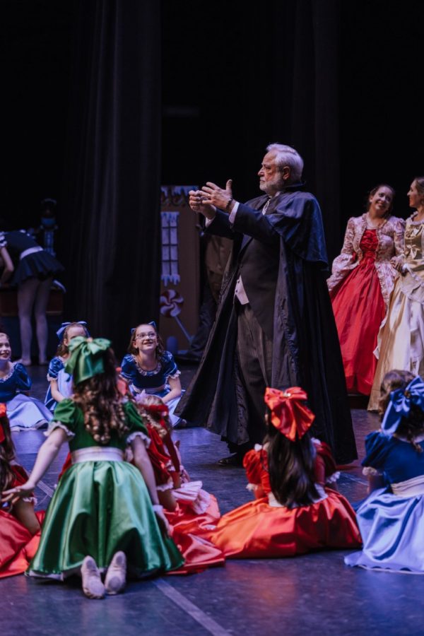 Herr Drosselmeyer, played by Chuck Schuetz, holds guests at the party in his spell during The Nutcracker at Cynthia Woods Mitchell Pavilion on Nov. 17.