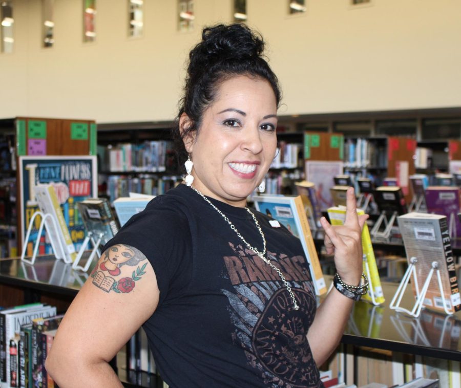Librarian Dolores Lamoglia shows off her book themed tattoo after the pep rally Thursday in the library.  