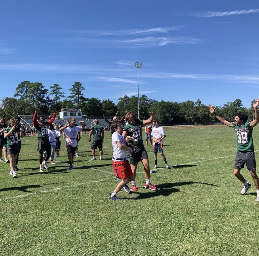 Junior Steele Herndon (91) celebrates with his brother Will (center) as teammates join in.  The Challenger game was held Oct. 19 at Willig Field.