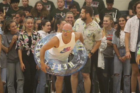Coach Mac getting ready to take on the students in the tube races. In the end the teachers pulled through and won.