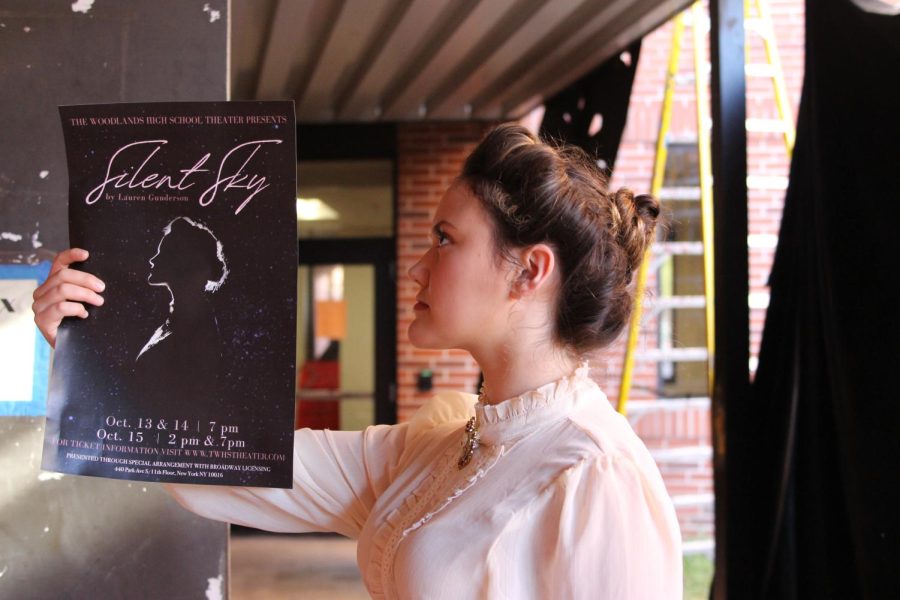 Sophia Hickman-Chow playing Henrietta Leavitt poses with the Silent Sky poster that was made with an actual picture of her.