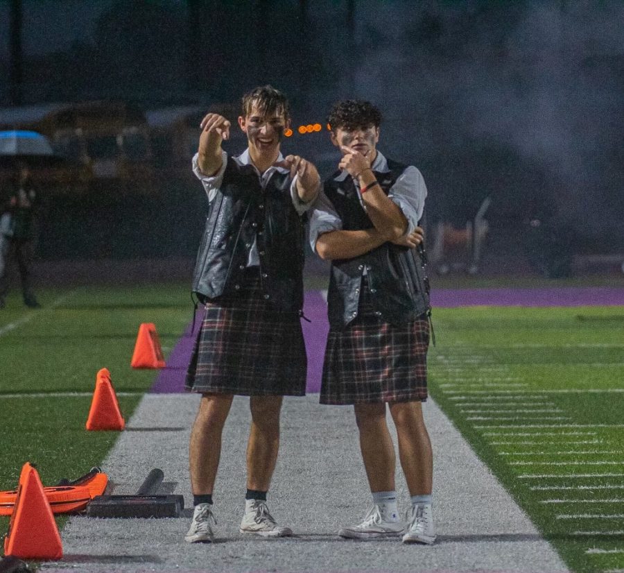 Grant (left) and Timmy (right) on the sidelines against Willis on Oct. 28 at Willis ISDs stadium.
