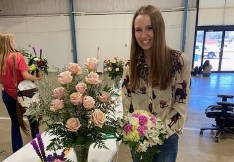 Reagan Weaver, with three of the bouquets she created as part of the competition.