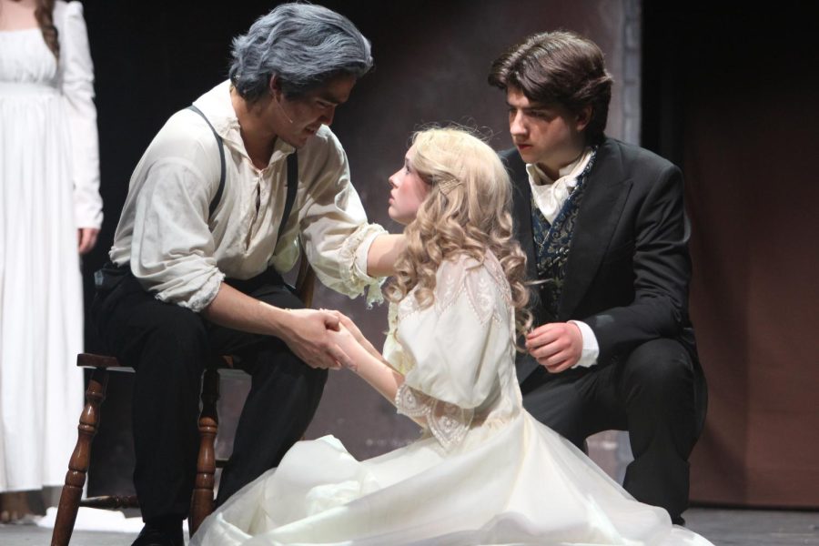 Valjean (Hallare) and Marius (Wiley Sadlier) talk with Cosette (Peyton Jones) prior to her death.