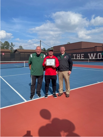 Assistant tennis coach wins award