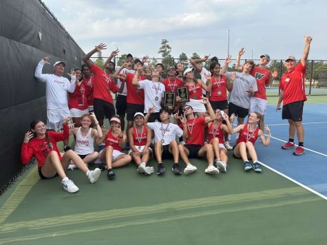 Tennis celebrates after winning the district meet at TWHS.