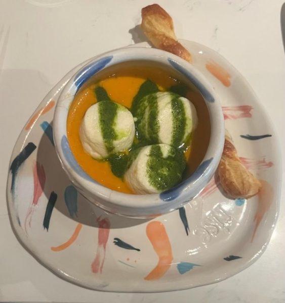 The marshmallow soup has three tiny souffles, which is served in custome