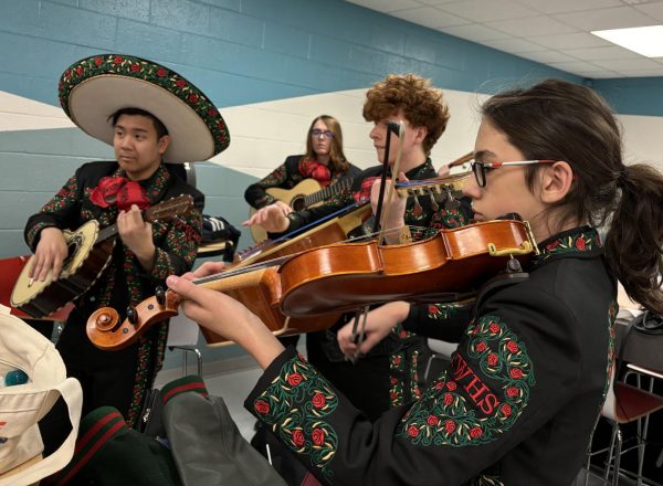 The students warmed up in an adjacent cafeteria prior to their performance at Robstown.