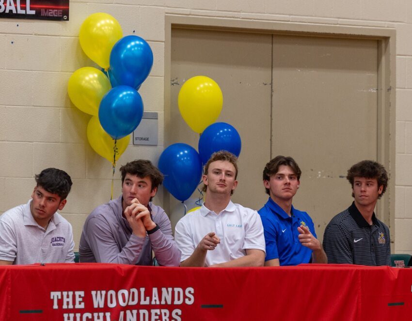 Baseball players Lucas Mercado, Declan Magee, Kyle Hubert, Tanner Farnsworth and Jaxson Breedlove at the signing day event in the gym.