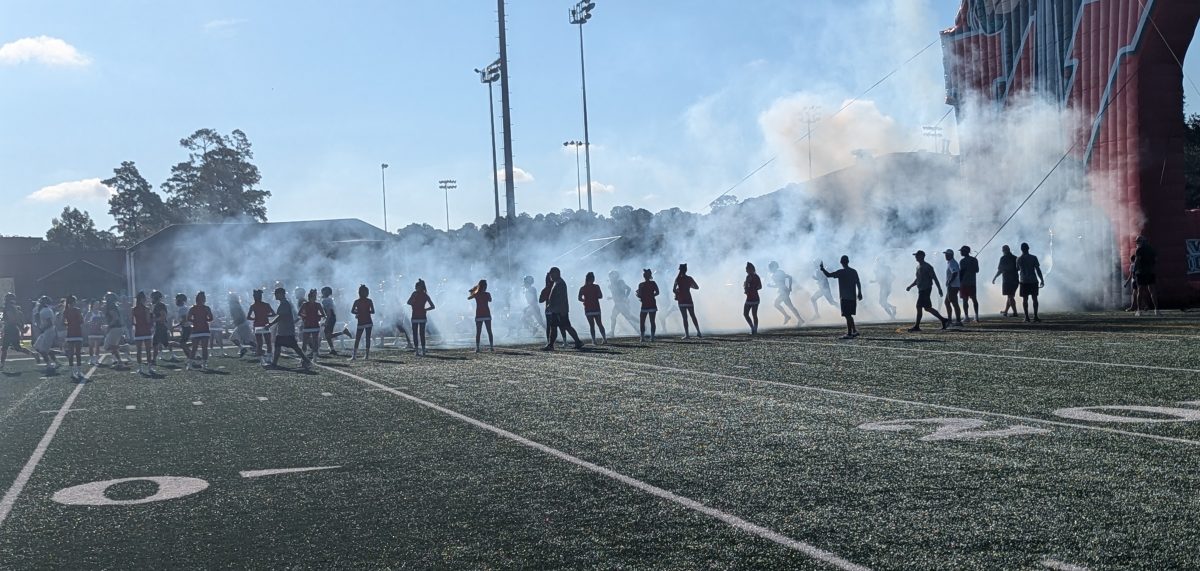 TWHS football team taking the field for a preseason scrimmage