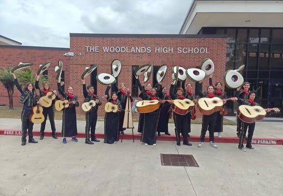 The Rojo y Verde Mariachi poses in front of TWHS.