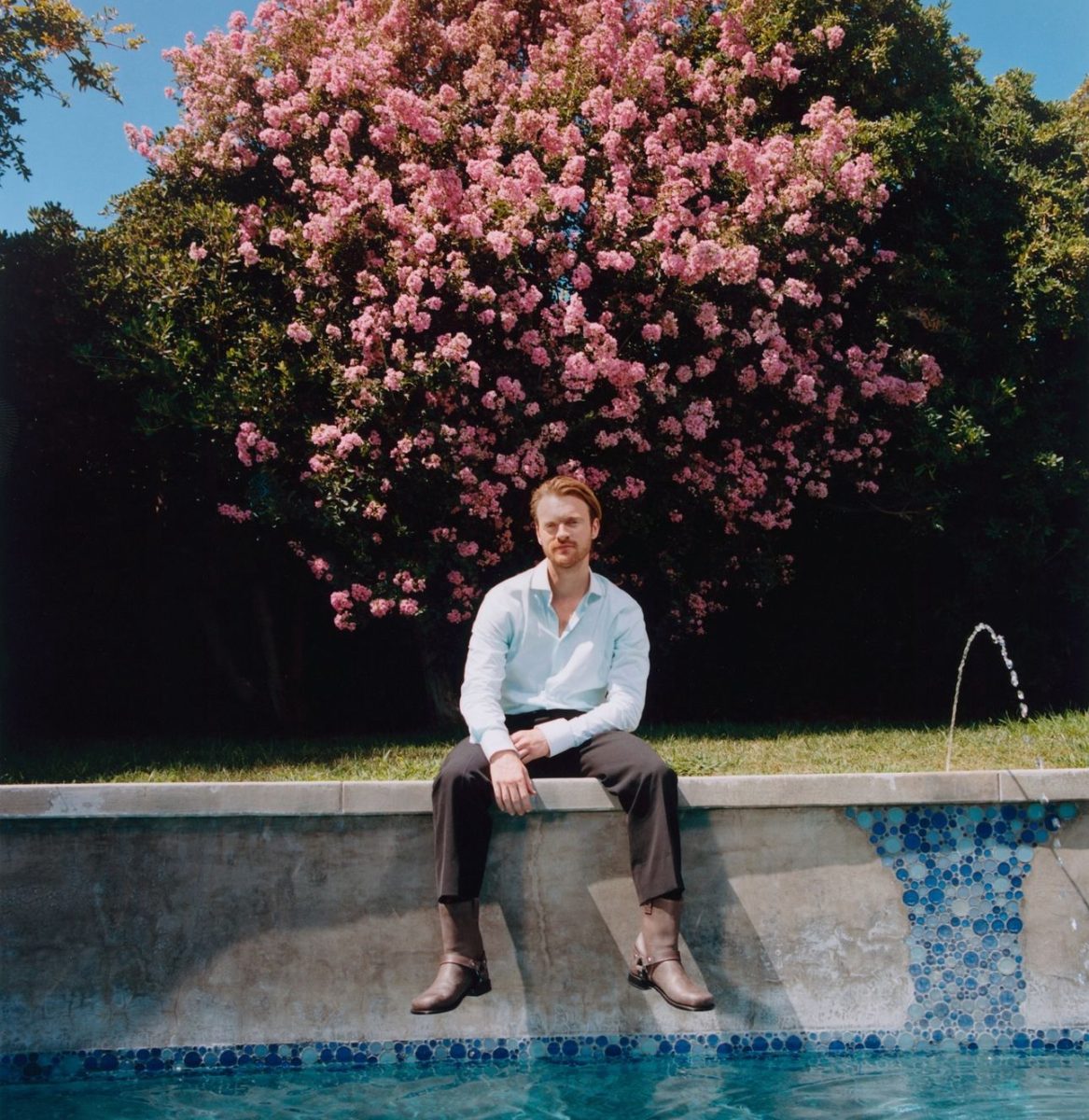 FINNEAS poses for Vouge Magazine on the edge of a pool, found on his Instagram @finneas.