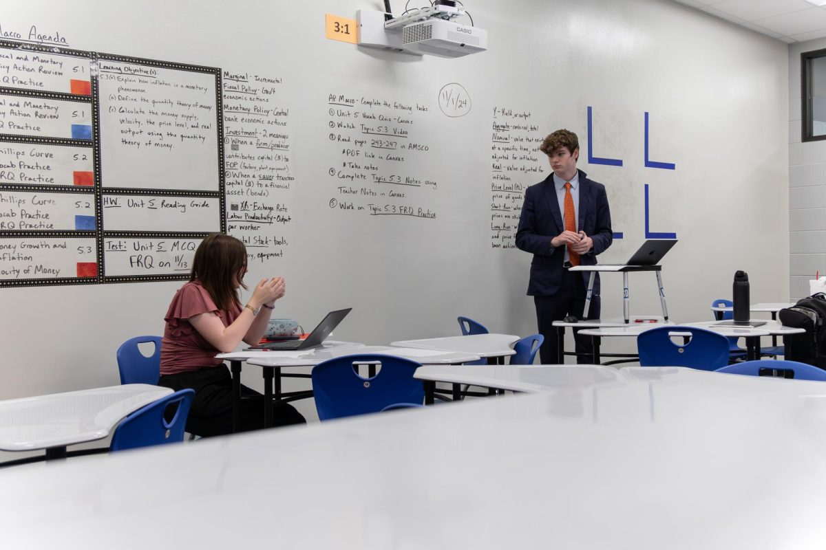 Leah Bronfman of TWHS and Jackson White of Klein Oak High School debate.