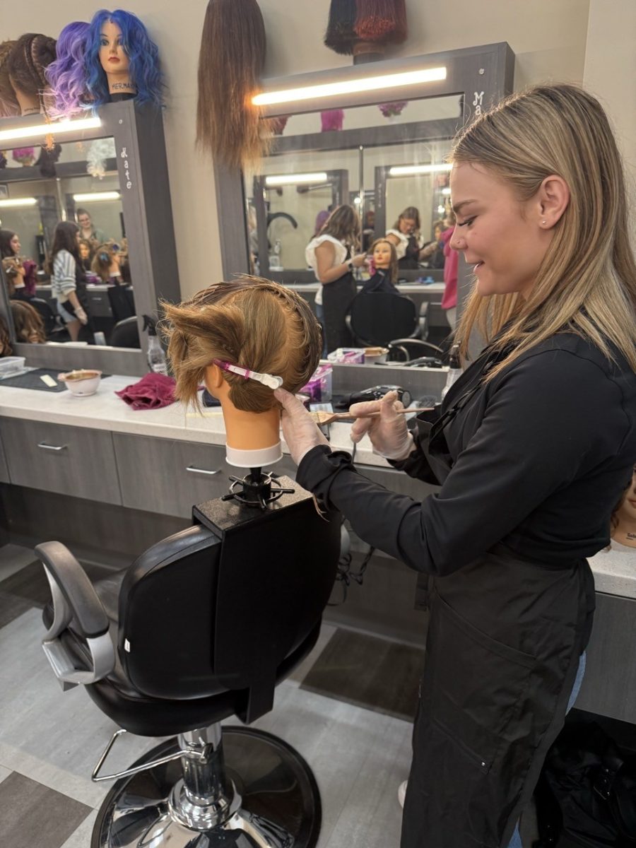 Madison Canon works on perfecting her skills on her mannequin. 