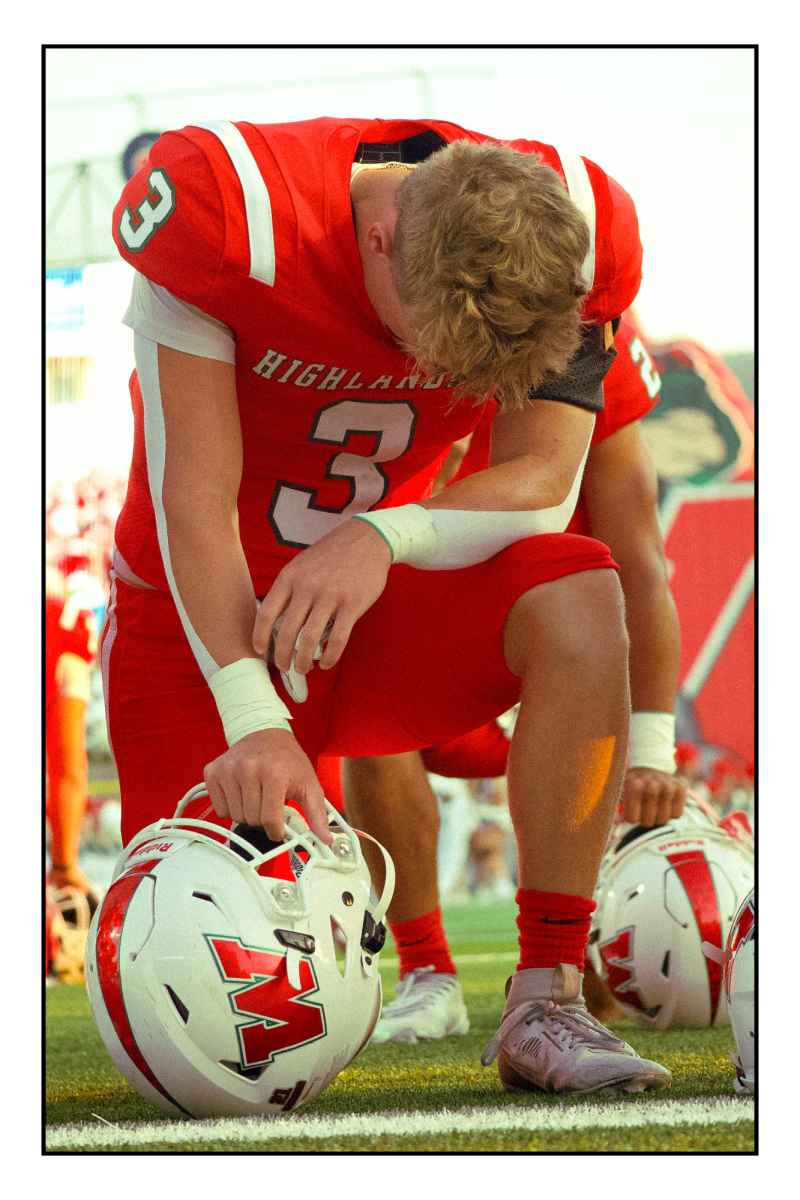 Caycen Bartolazzi, kneeling before the game.