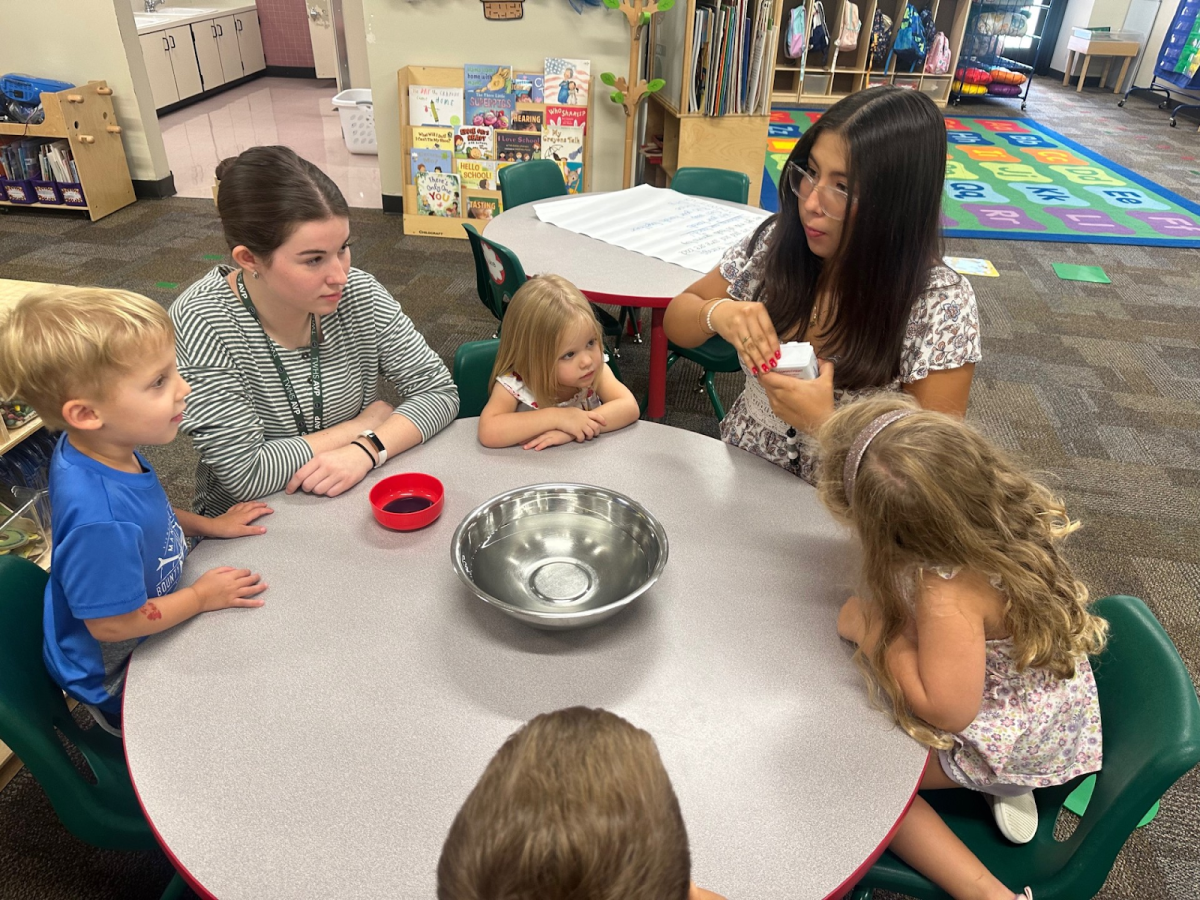 Bailey Mitchins and Mariana work with the children in the Little Lander Programs. 