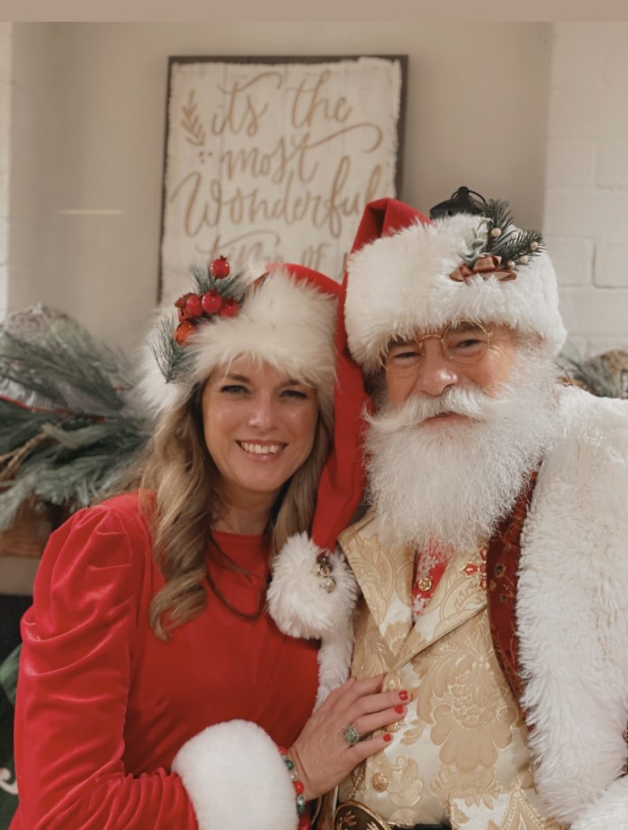 Mr. and Mrs. Claus smiling for the camera during the most wonderful time of year. 