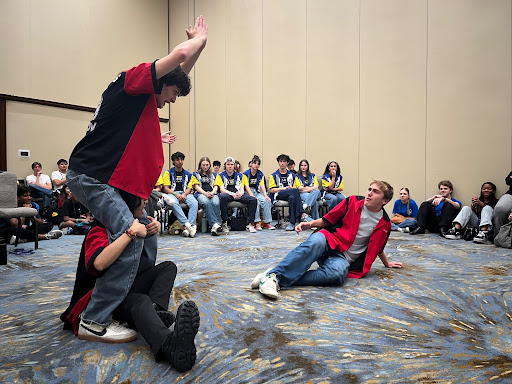 Pictured L to R: Otto Lopez (11), Vallen Tran (11), Charley Kaye (10), as they play live scenery in the improv final. 