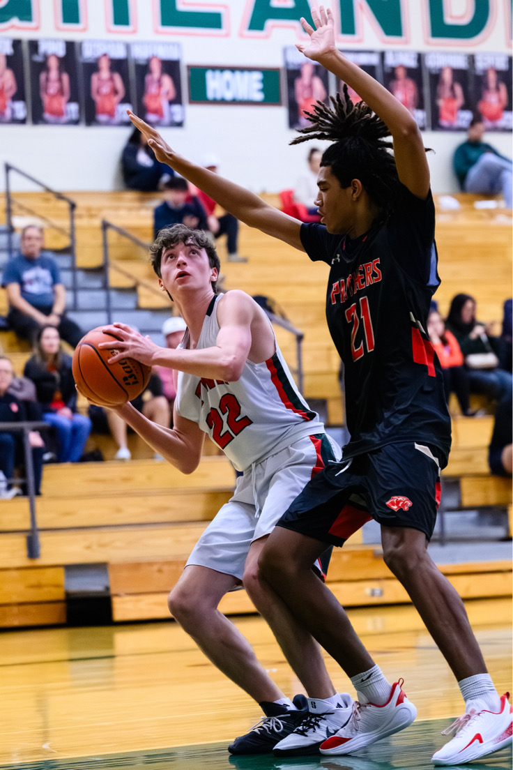 Gavin Stein, number 22, playing Basketball for TWHS. Photo by Gina Gallagher, used with  permission.