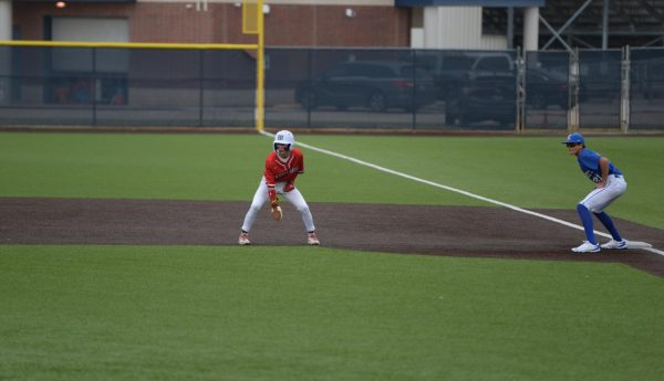 Colton Lillard taking his lead off of first base during the spring 2026 baseball season. Photo by Ashley Moore, used with permission.