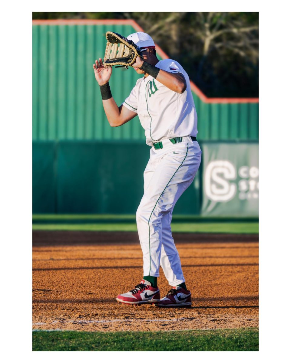 Cruz Romo #9 (Class of 2027) catching a pop fly on first base.
