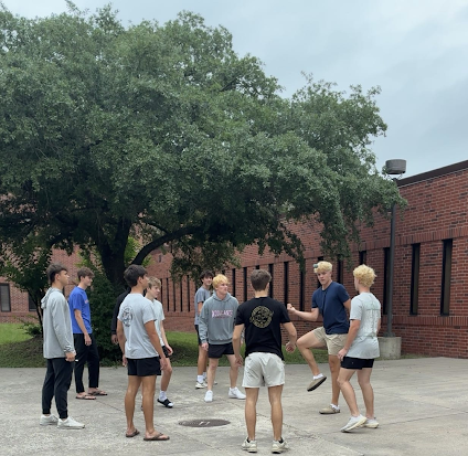 Cash Clayton, Cash McWhorter, Brady Schneider and friends in the courtyard playing hacky sack during lunch on Friday, May 15.   
